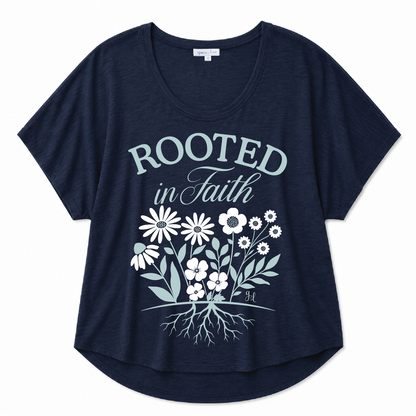 Navy blue scoop neck tee featuring a "Rooted in Faith" floral graphic with a botanical root design on a white background