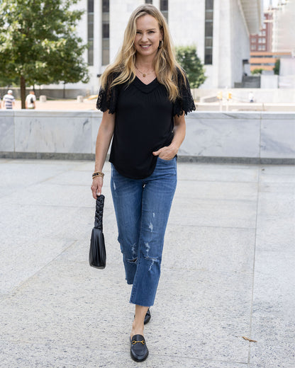 full body view of black sable lace sleeve top