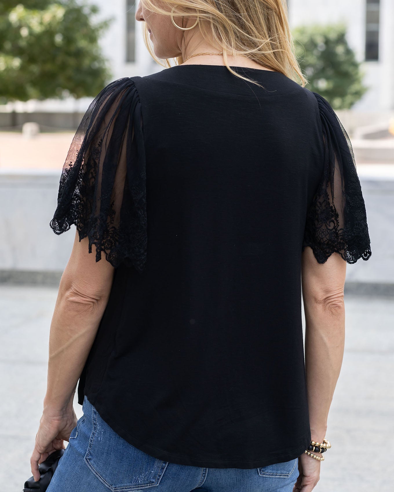 back view of black sable lace sleeve top