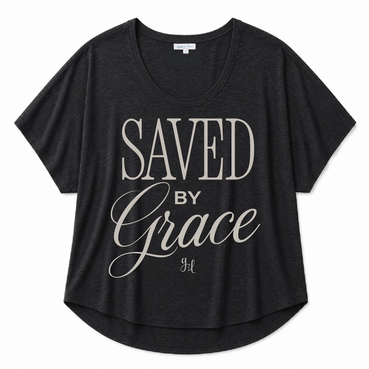 Black scoop neck tee featuring a "Saved By Grace" inspirational graphic in light gray lettering on a white background