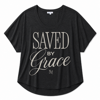 Black scoop neck tee featuring a "Saved By Grace" inspirational graphic in light gray lettering on a white background