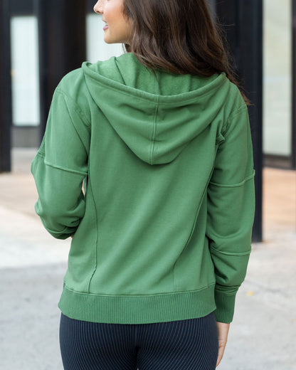 back view of hedge green zip up hoodie