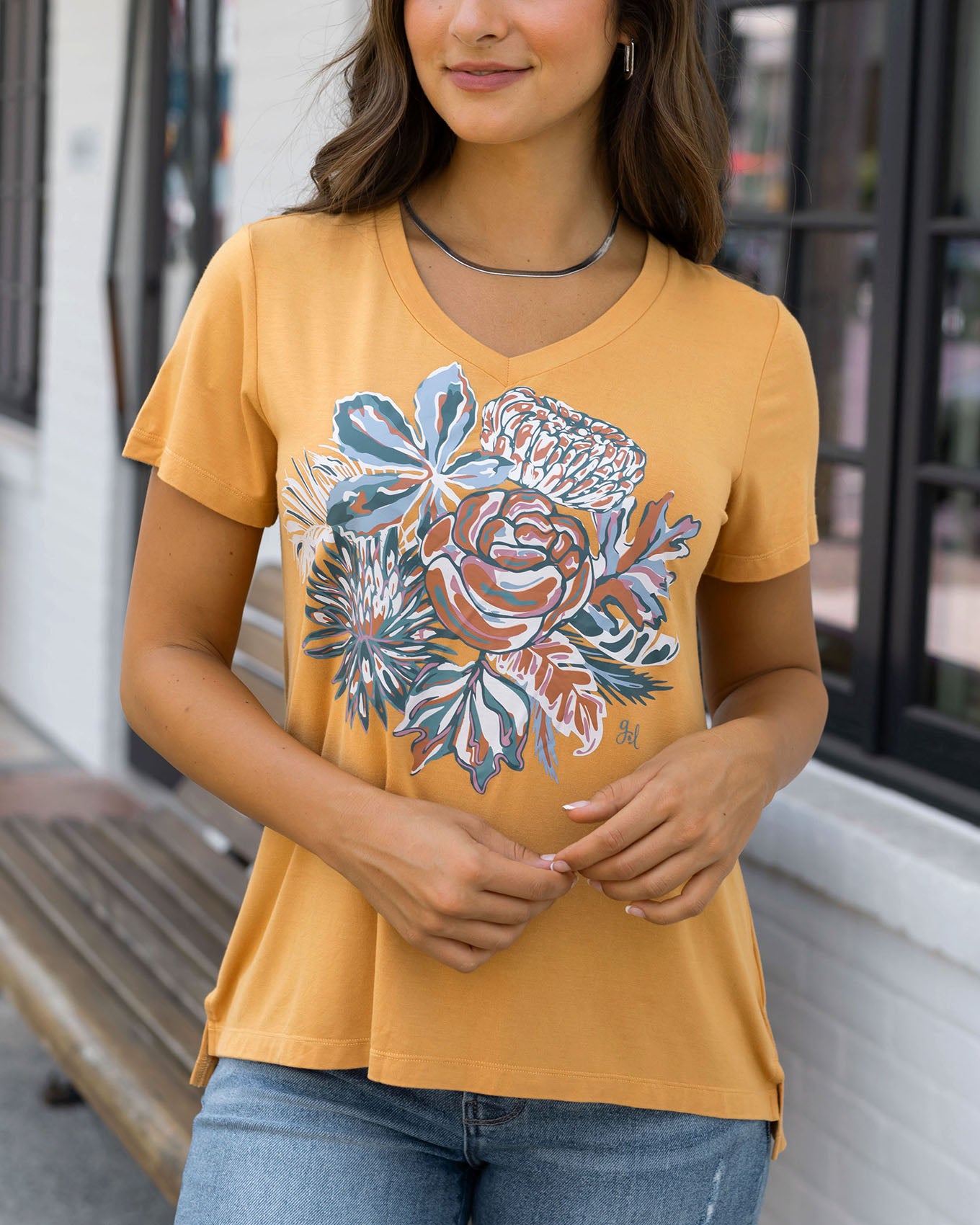 front view of sketched floral graphic tee in mustard floral