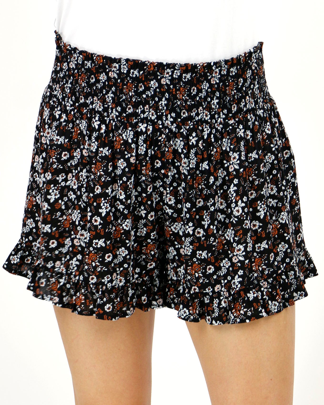 Stock shot front view of black ditsy smocked shorts