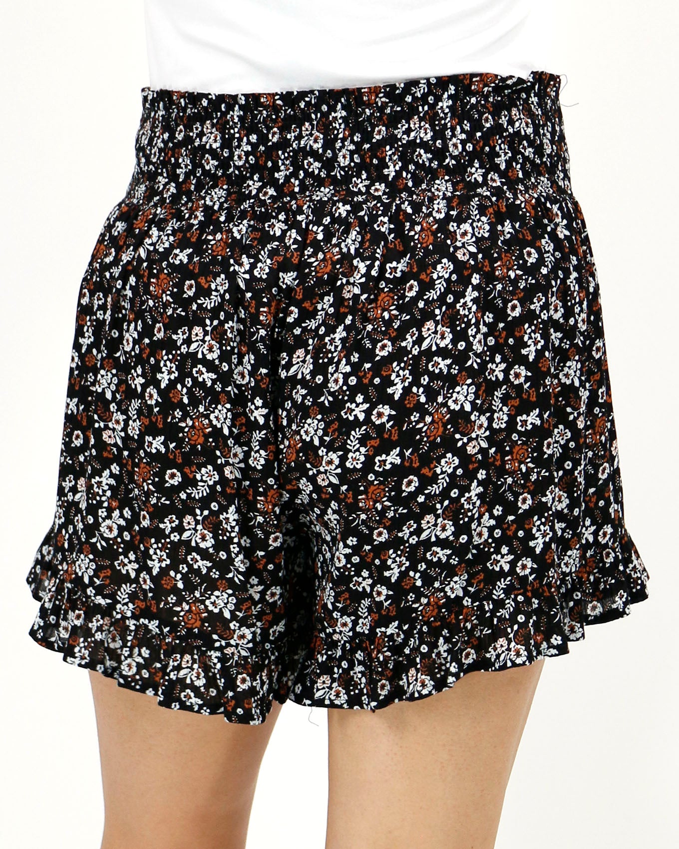 Back view stock shot of black ditsy smocked shorts