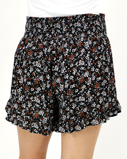 Back view stock shot of black ditsy smocked shorts
