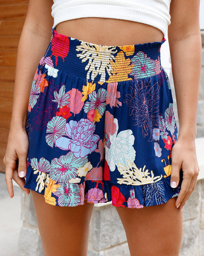 Front view of sketched floral smocked shorts