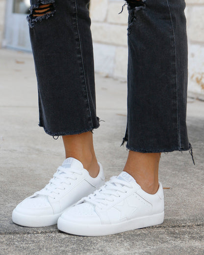 styled view of white star sneakers
