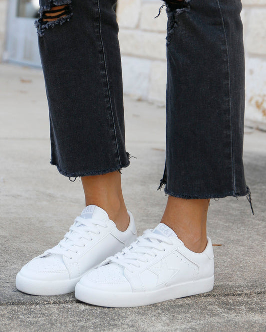 side view of white star sneakers