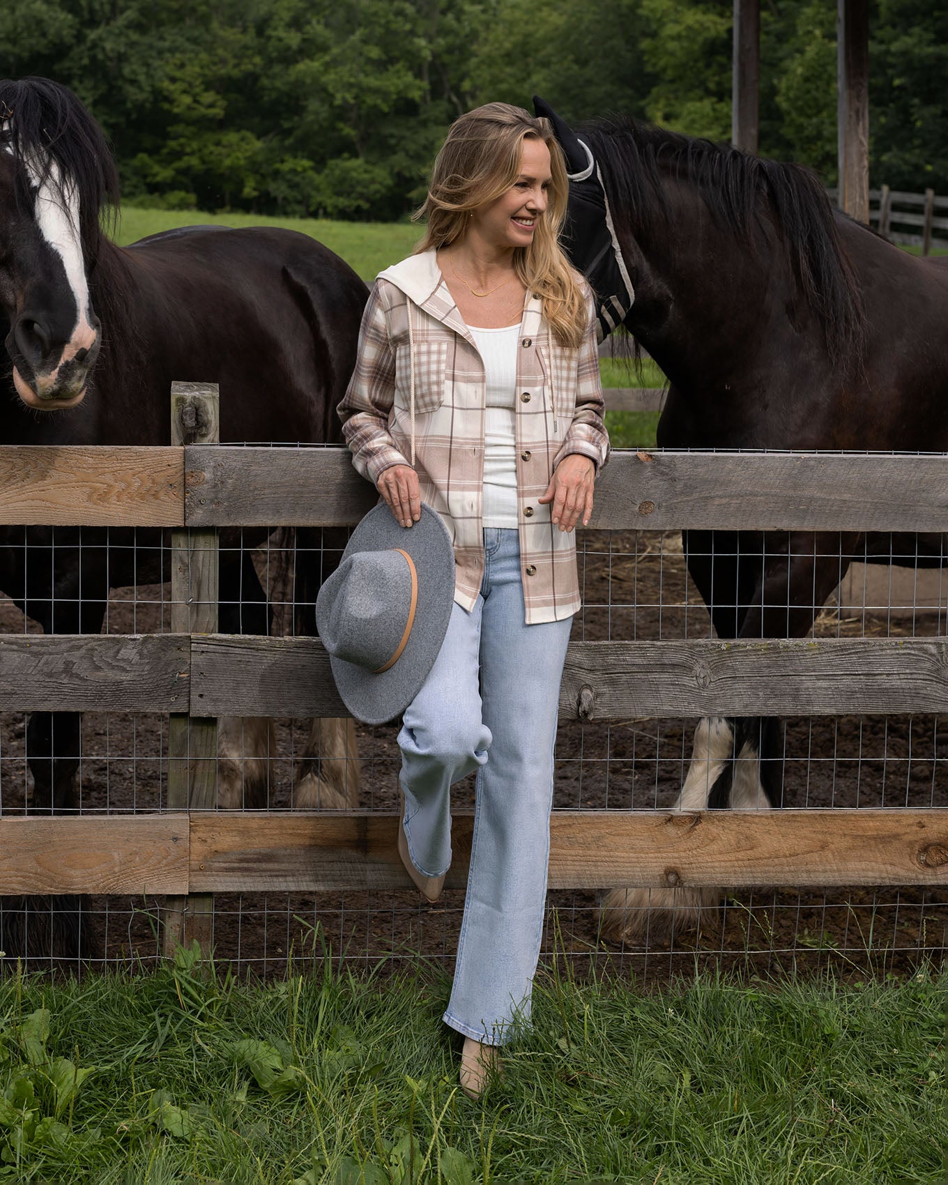 full body view of mixed neutral plaid hooded shacket