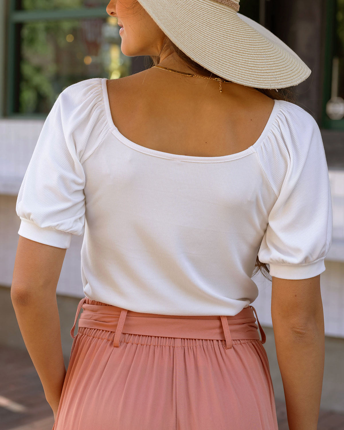 Back view of ivory ribbed knit top