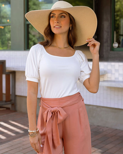 Styled front view of ivory ribbed knit top