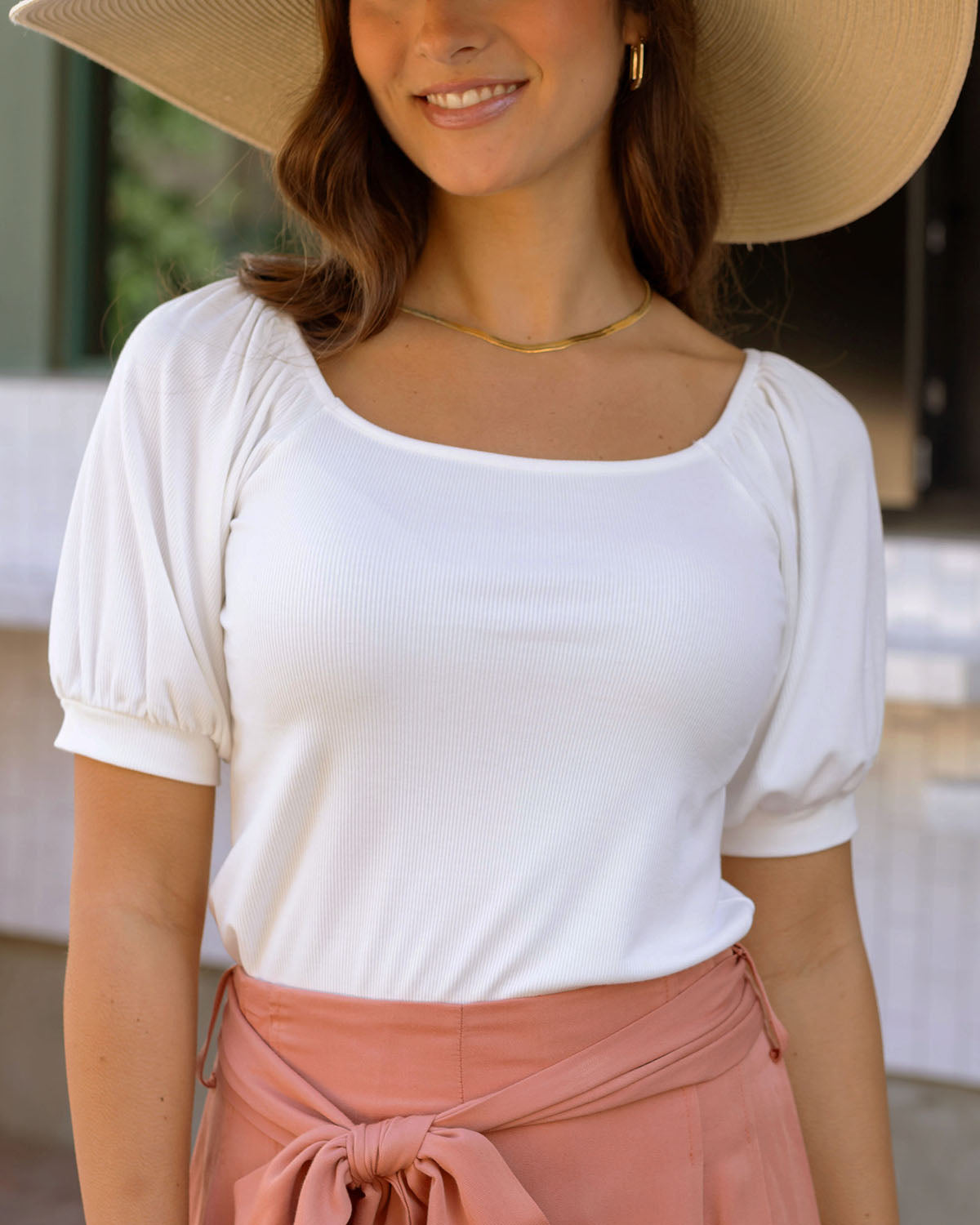Front view of ivory ribbed knit top
