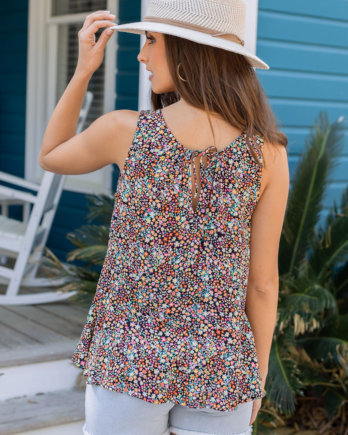 Back view of black floral ditsy print swing tank top