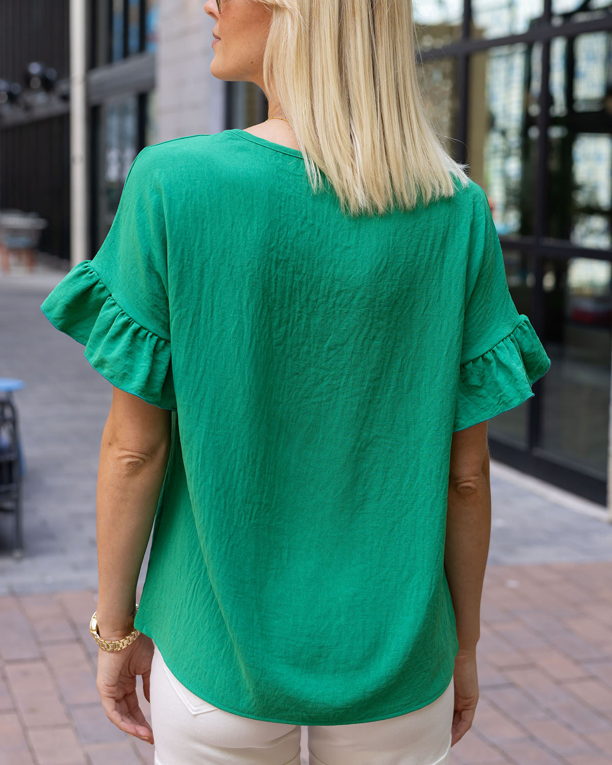 back view of vivid green ruffle sleeve shift top women's shift blouse