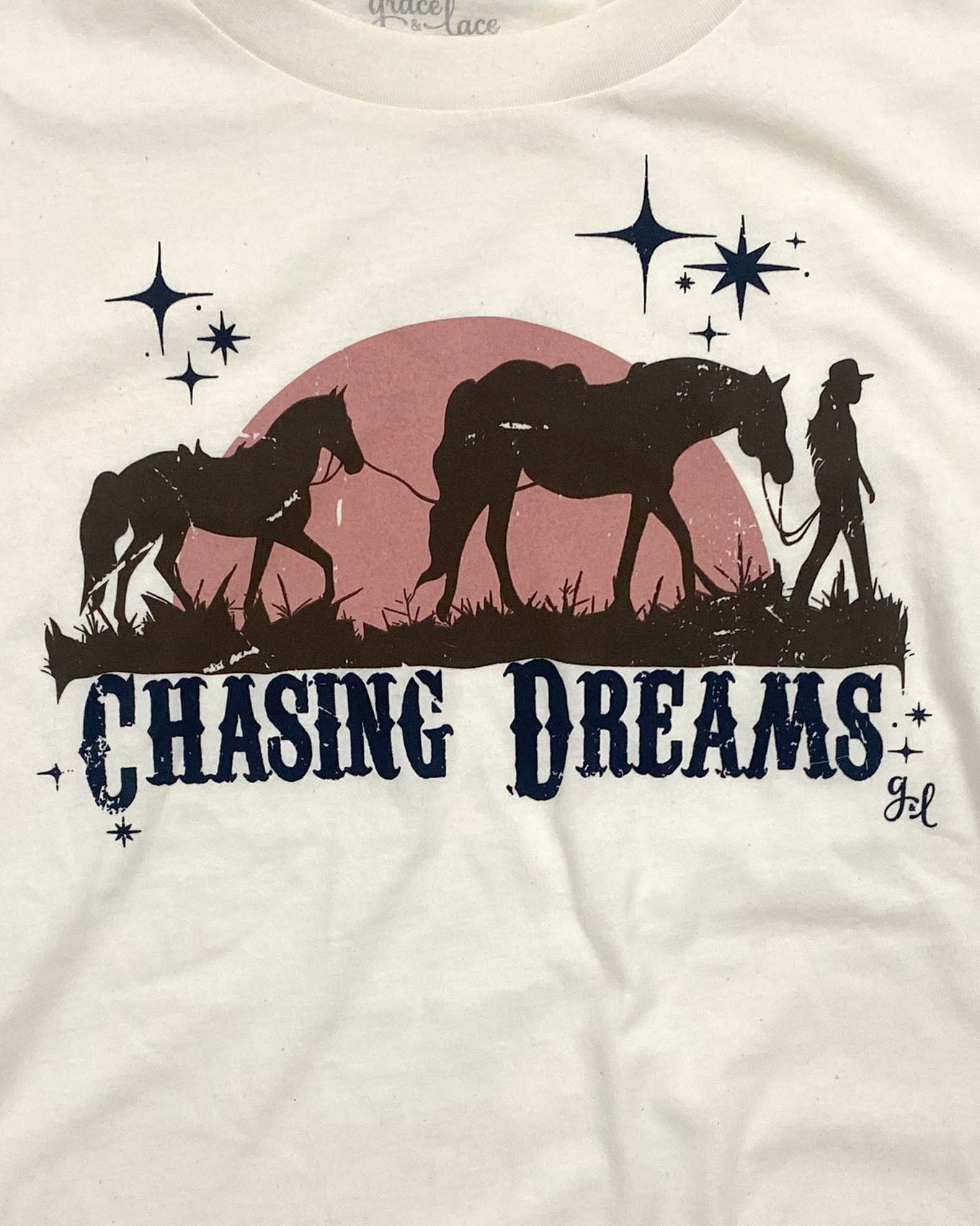 detail view of chasing dreams graphic tee