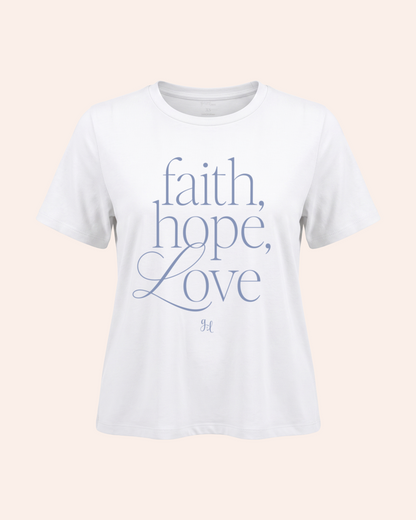 White t-shirt with 'faith, hope, love' text on a light pink background