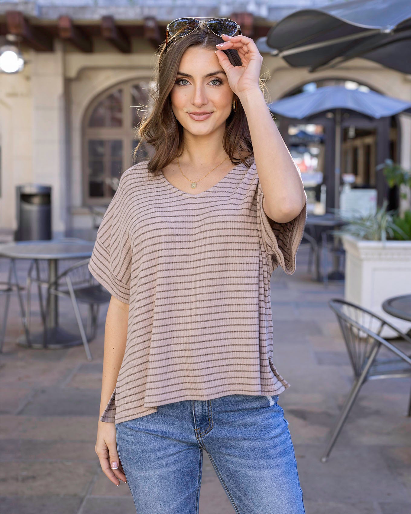 Styled view of Tan/Black Stripe Coziest Dolman Lounge Top