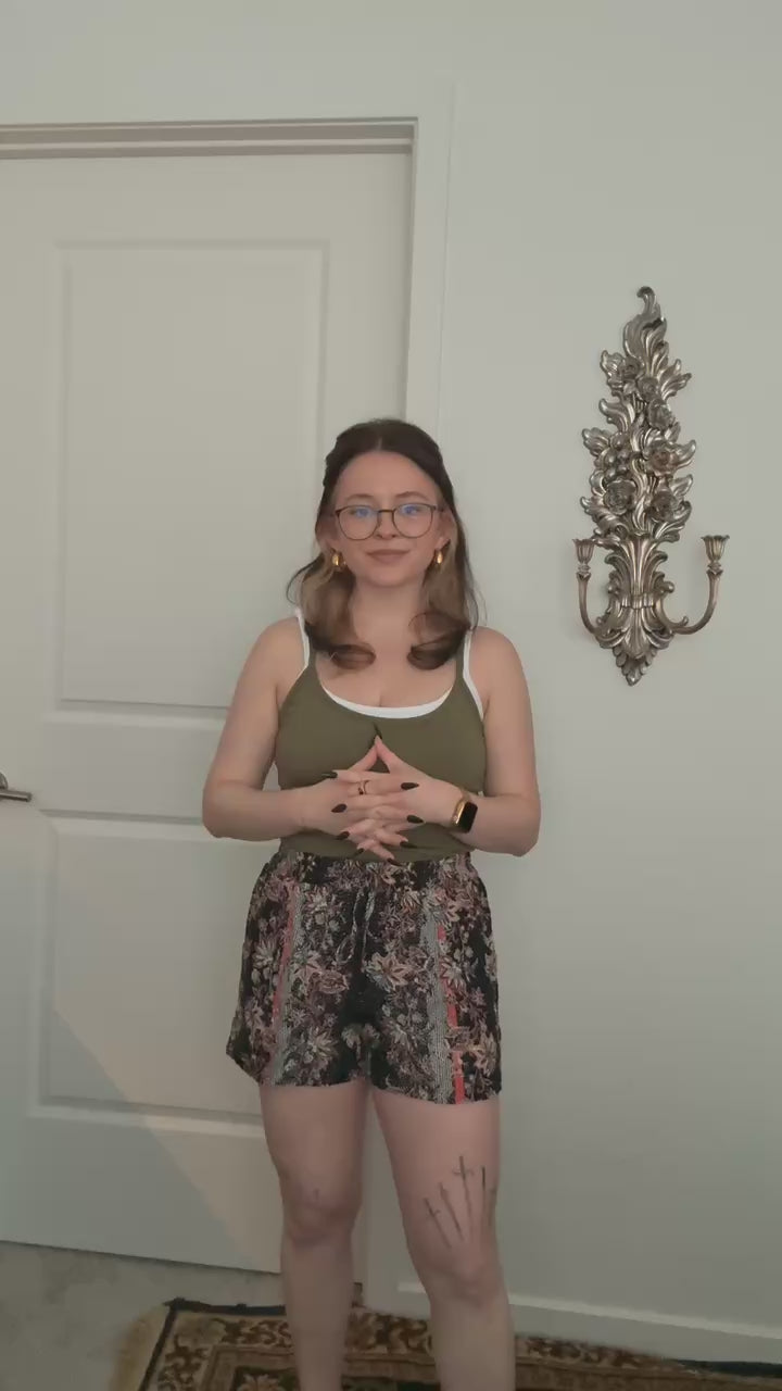 Try-on video of a model wearing the Boho Breeze Tie Shorts.