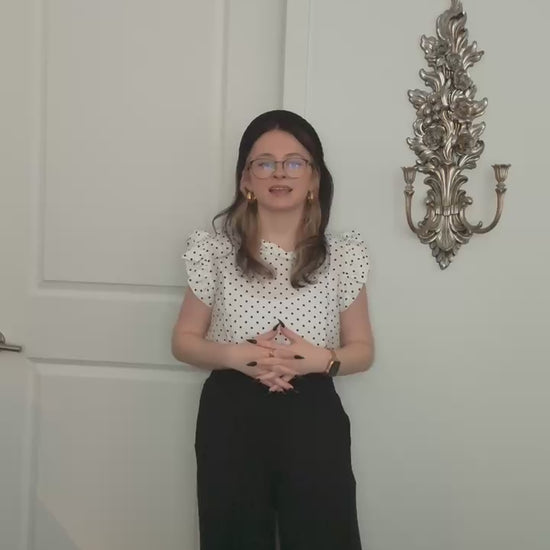 Try-on video of a model wearing the Smocked Wide Leg Pants in Black.