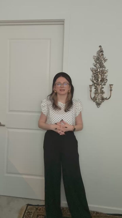 Try-on video of a model wearing the Smocked Wide Leg Pants in Black.