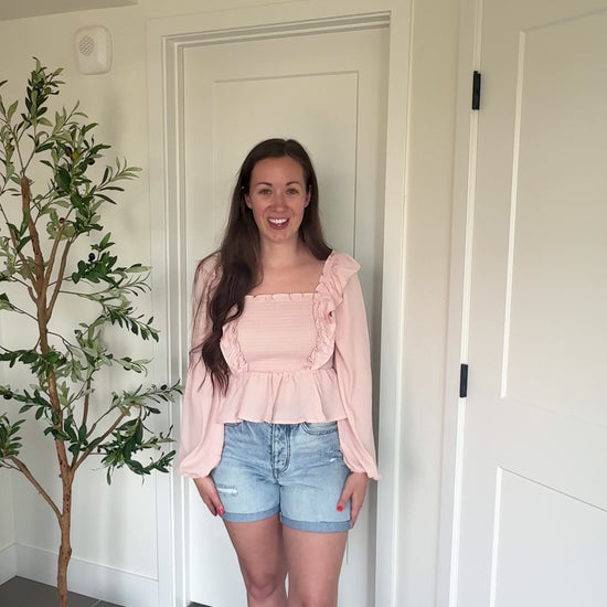 Try-on video of a model wearing the Soft Charm Chiffon Blouse.