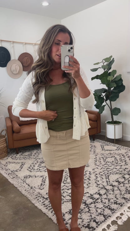 Try-on video of a model wearing the Flawless Fit Spaghetti Strap Tank in Olive.