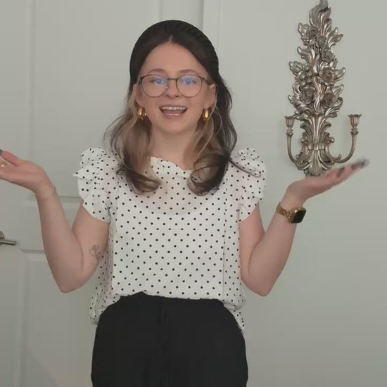 Try-on video of a model wearing the Effortless Ruffle Sleeve Top in Polka Dot.