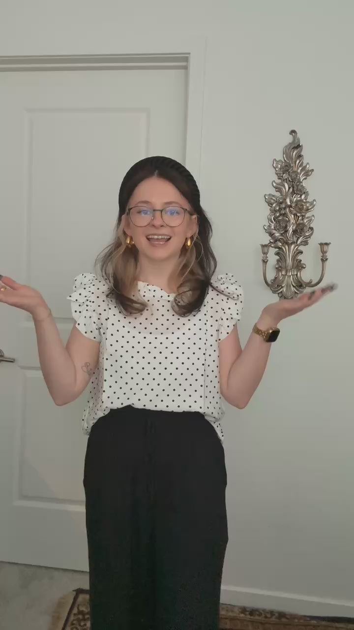 Try-on video of a model wearing the Effortless Ruffle Sleeve Top in Polka Dot.