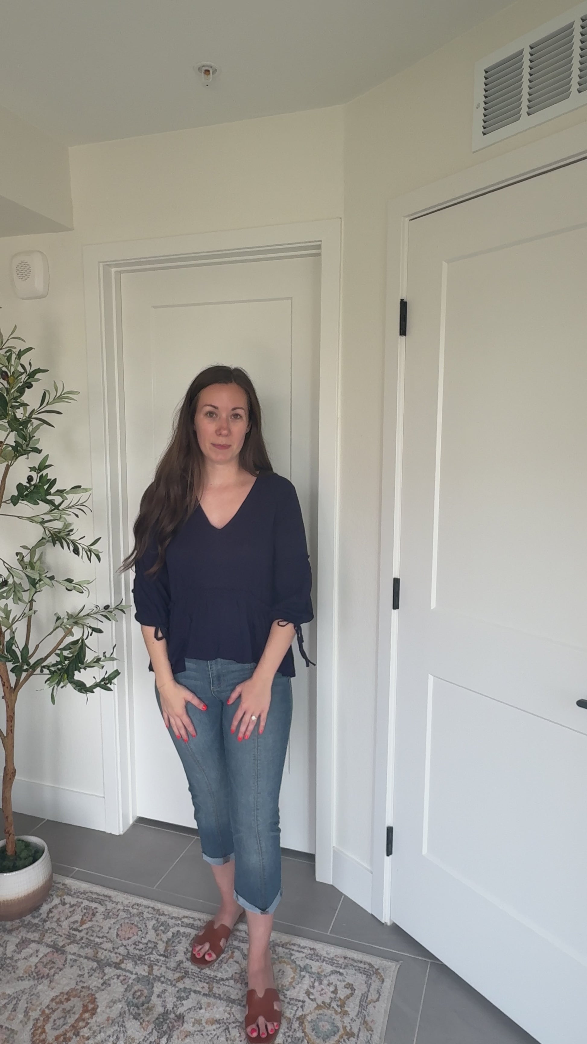 Try-on video of a model wearing the Soft Romance Peplum Blouse.