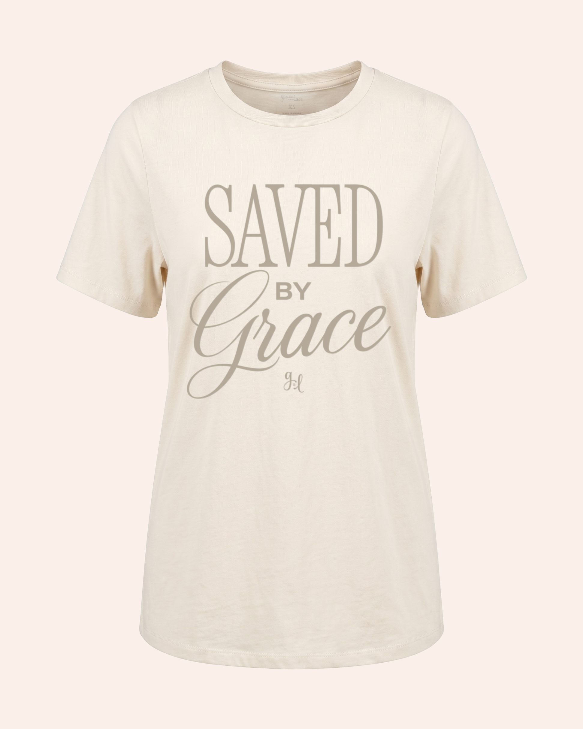 Beige t-shirt with 'Saved by Grace' text on a white background