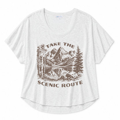 Navy graphic tee featuring a "Peace Comes in Waves" design on a beige background