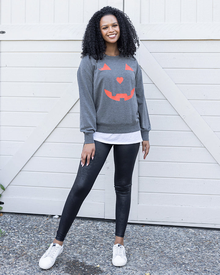 full body view of pumpkin sweatshirt