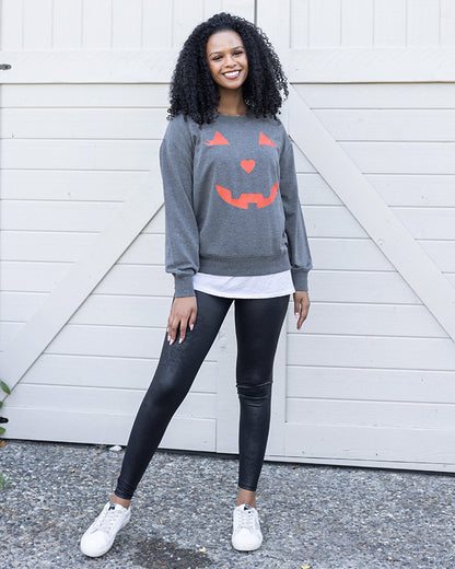 full body view of pumpkin sweatshirt